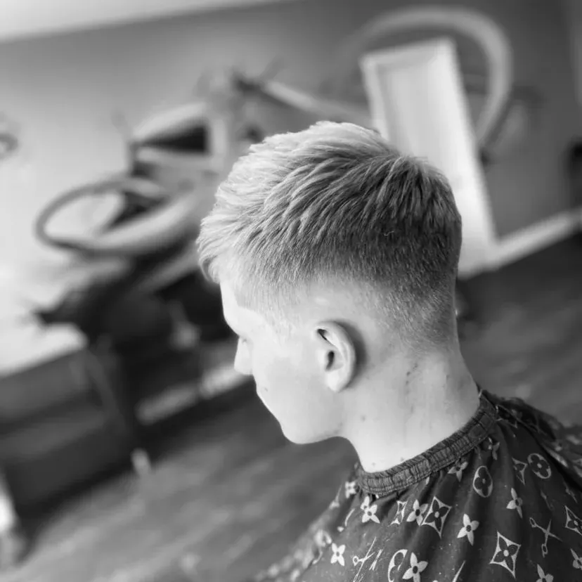 A fresh cut in black and white, from behind